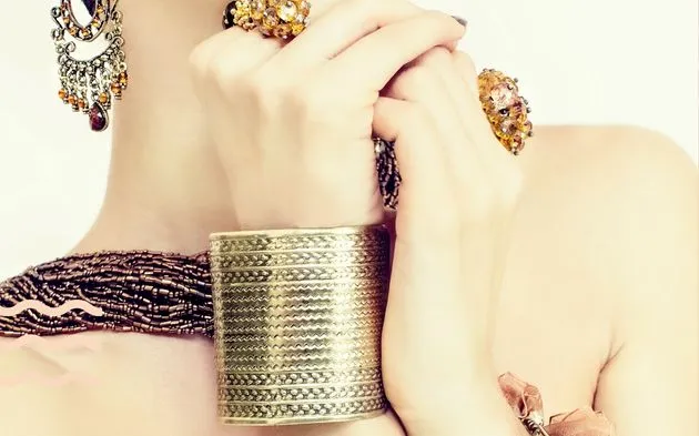 A girl flaunting a stackable bangals and rings.